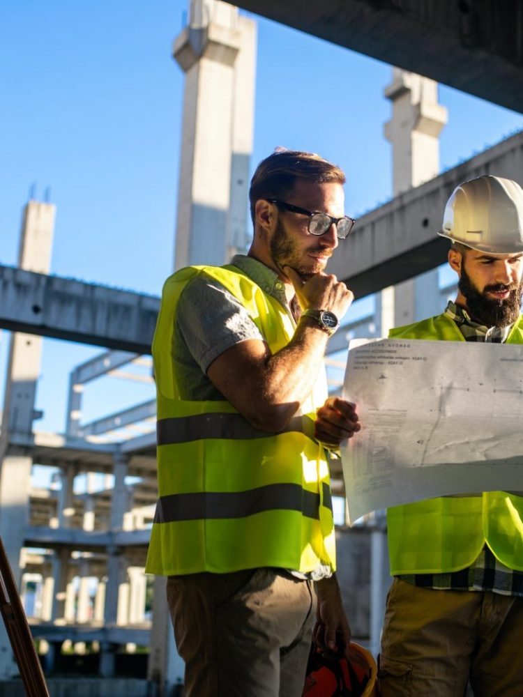 architect-and-engineer-construction-workers-working-at-outdoors-construction-site-1536x1024